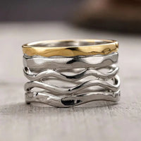 Zilveren brede golvende ring met goudkleurige rand