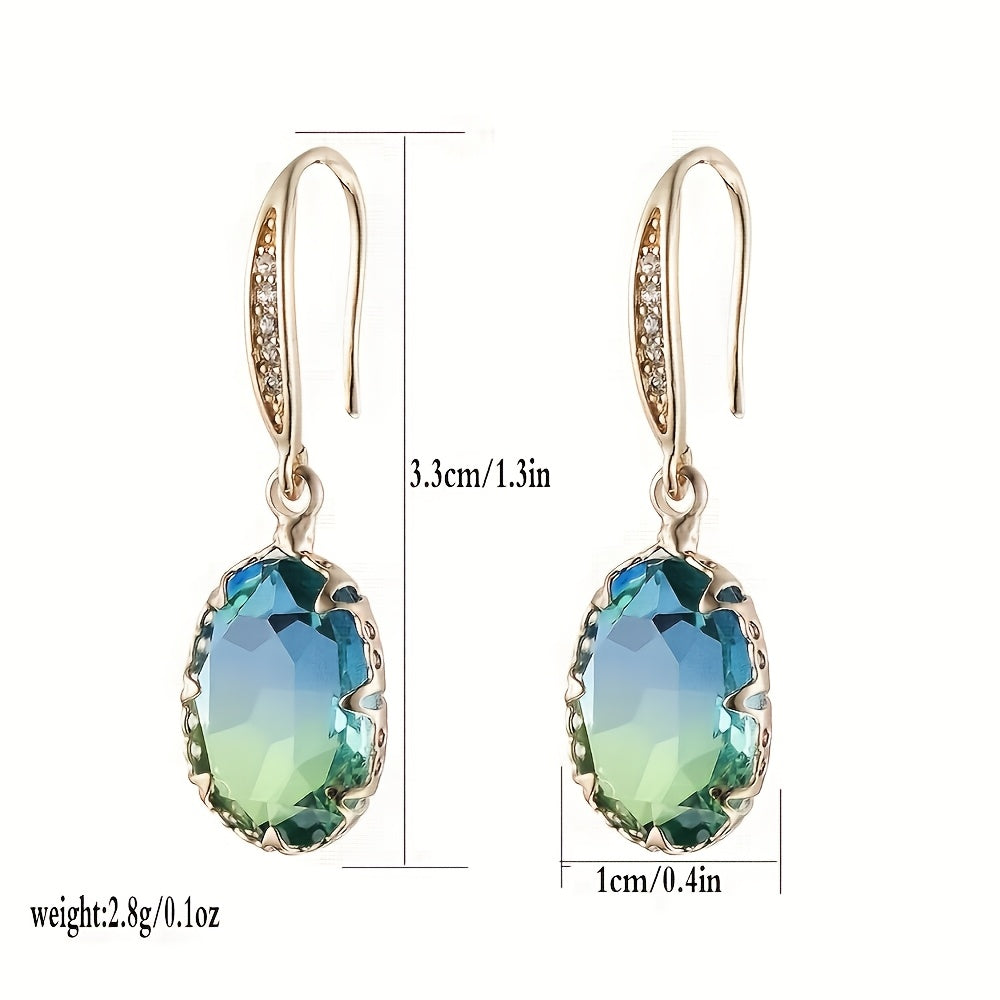 Gouden oorbellen met ovale blauwgroene steen