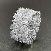 Zilveren brede ring met marquise zirkonia bloemtros