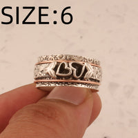 Zilveren spinner ring met hartjes en bloemen