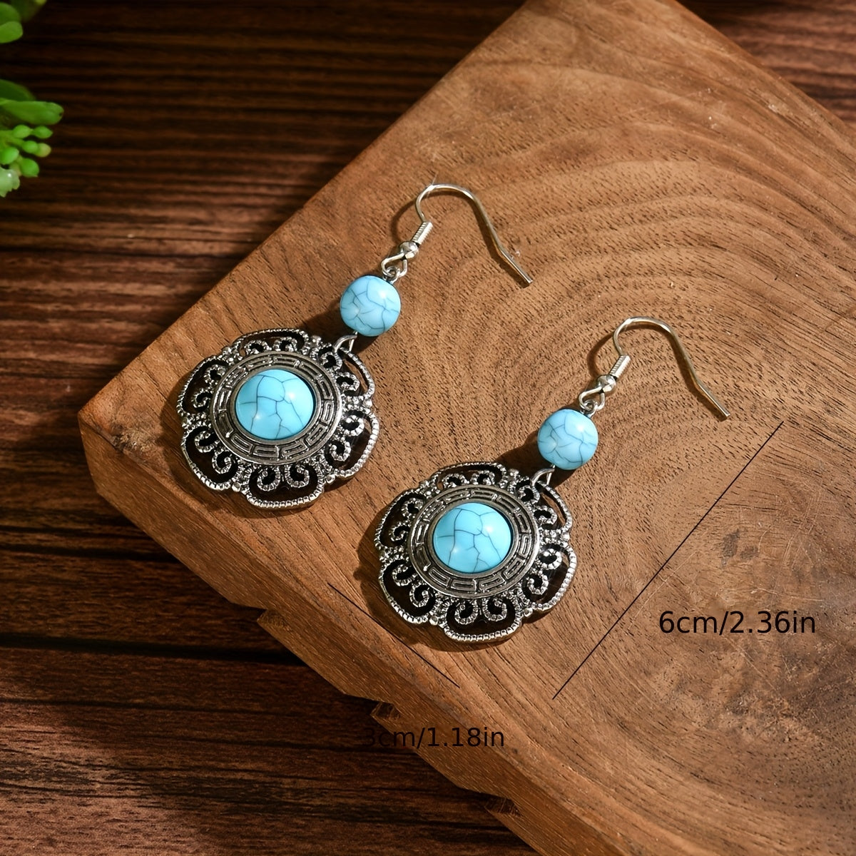 Zilveren boho hartoorbellen met vlinder en turquoise