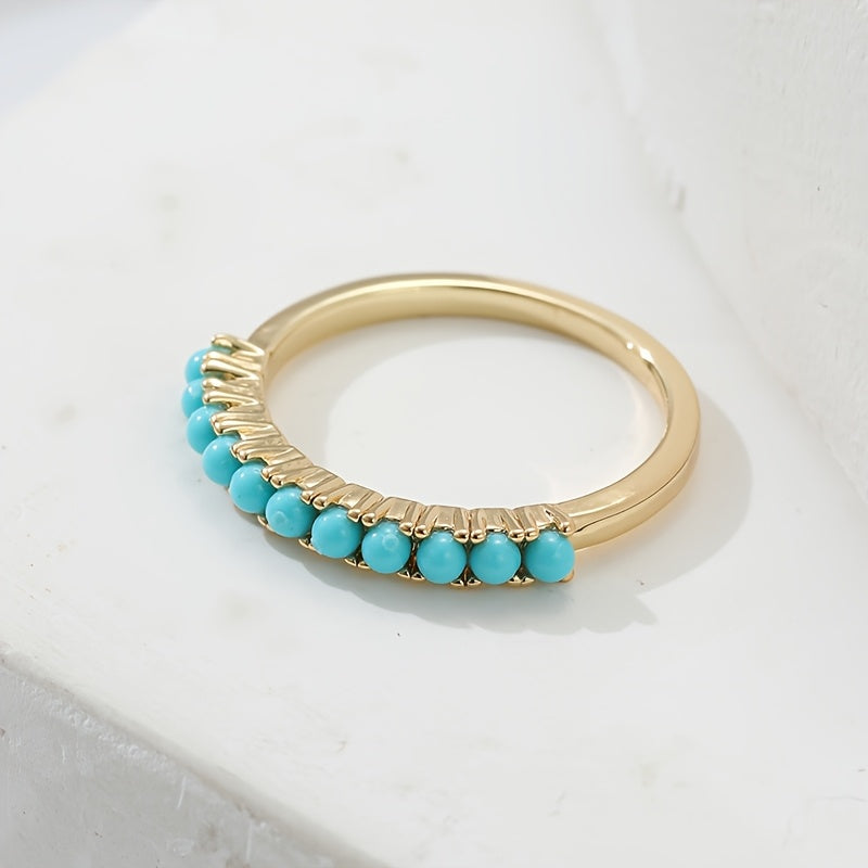 Gouden ring met rij turquoise kralen