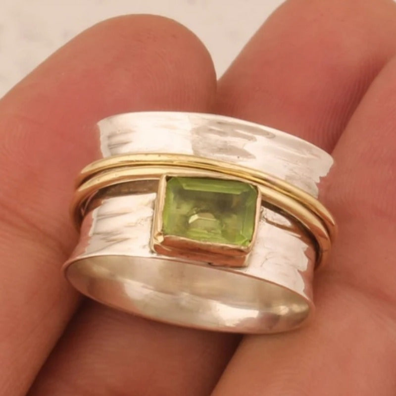 Zilveren spinner-ring met groene peridot
