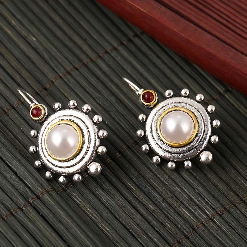 Vintage oorbellen met parel en rode steen