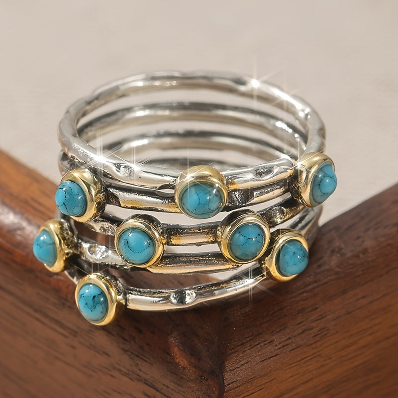 Zilveren ring met turquoise edelstenen en goudaccent