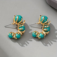 Gouden ring met ovale turquoise edelsteen