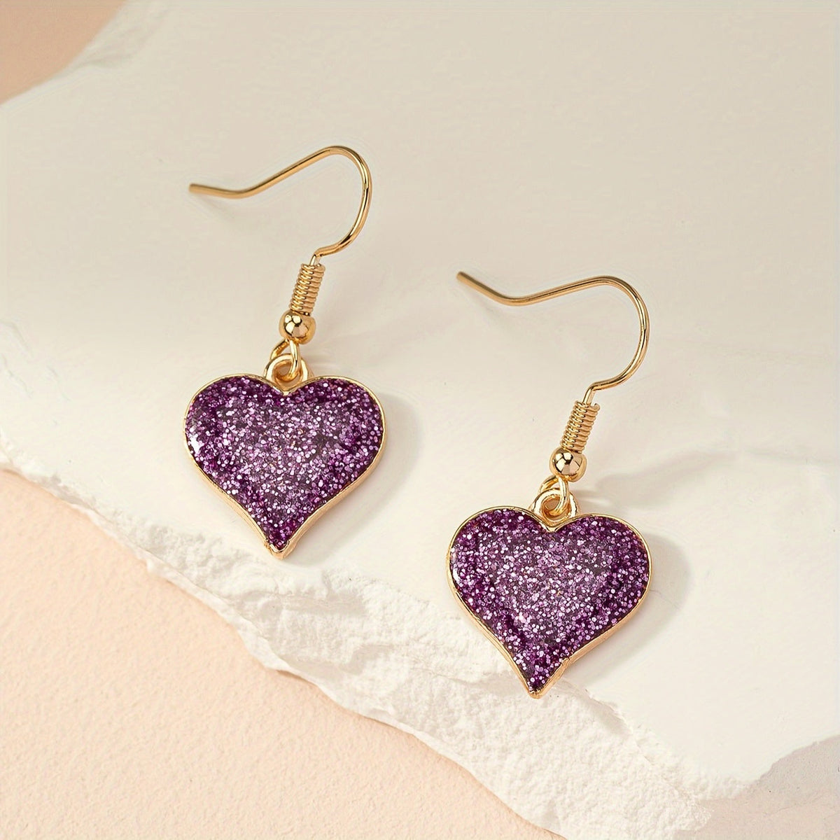 Paarse glitter oorbellen met hart