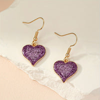 Paarse glitter oorbellen met hart