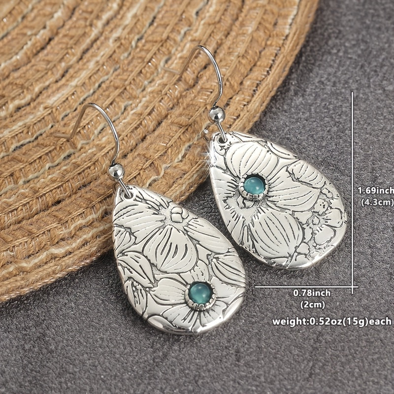 Zilveren oorbellen met gegraveerde bloem en turquoise