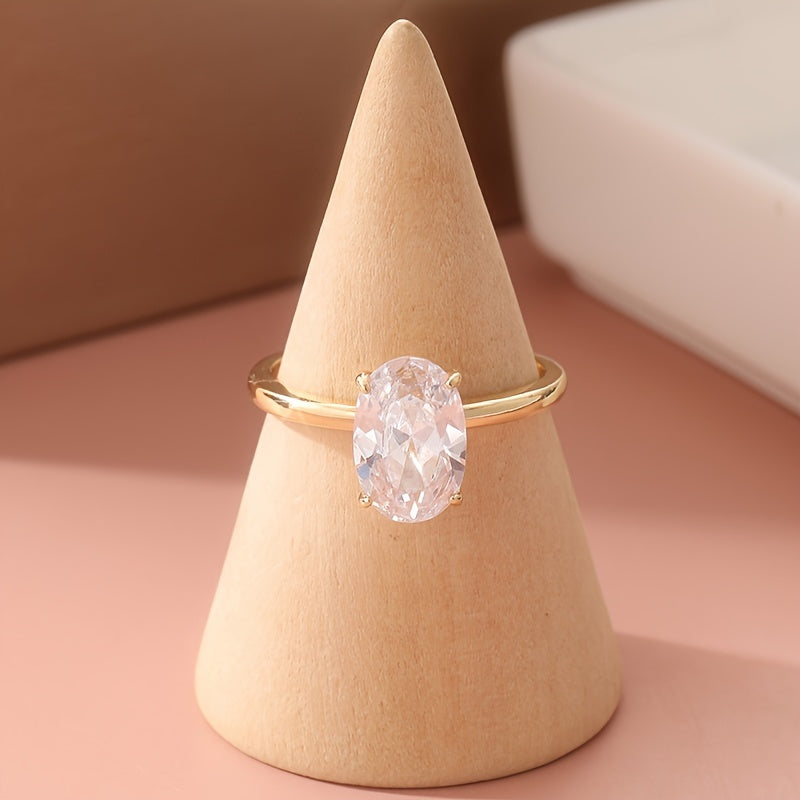 Gouden ring met ovale zirkonia en baguette band