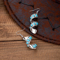Zilveren oorbellen met spiraal en turquoise