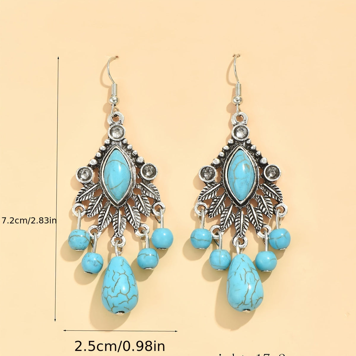 Zilveren bohemian oorbellen met turquoise kralen en bedels