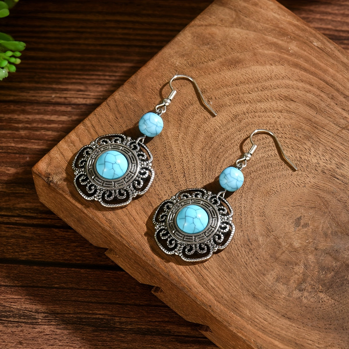 Zilveren boho hartoorbellen met vlinder en turquoise
