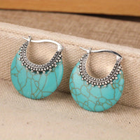 Zilveren bohemian oorbellen met turquoise schijf