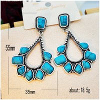 Zilveren bohemian oorbellen met turquoise waaier