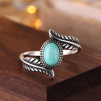 Zilveren ring met veer en turquoise