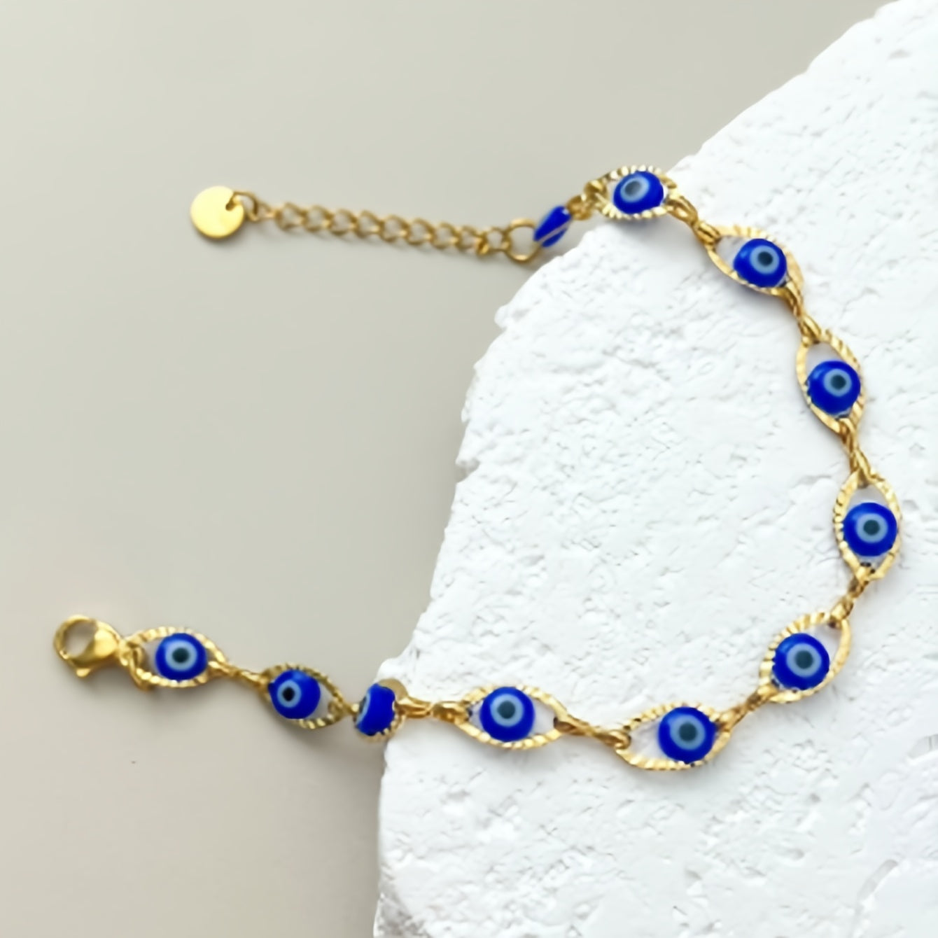 Gouden armband met blauwe boze oog kraaltjes