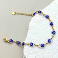 Gouden armband met blauwe boze oog kraaltjes