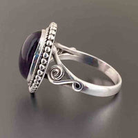 Zilveren vintage ring met ovale roze edelsteen