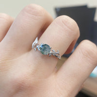 Zilveren ring met mosagaat en bladmotief
