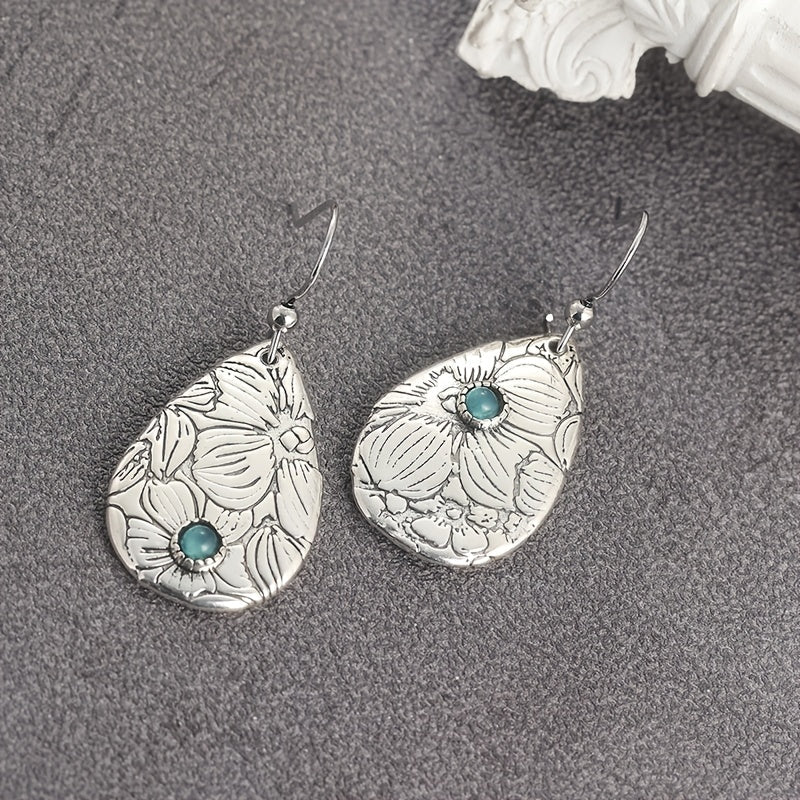 Zilveren oorbellen met gegraveerde bloem en turquoise
