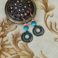 Bohemian oorbellen met roségoud spiraal en turquoise