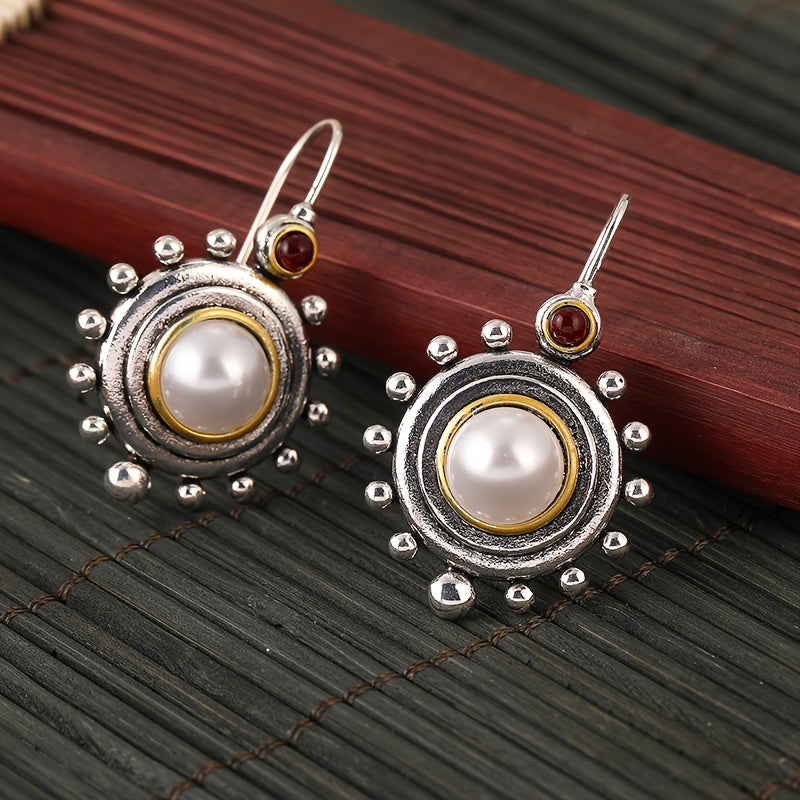 Vintage oorbellen met parel en rode steen