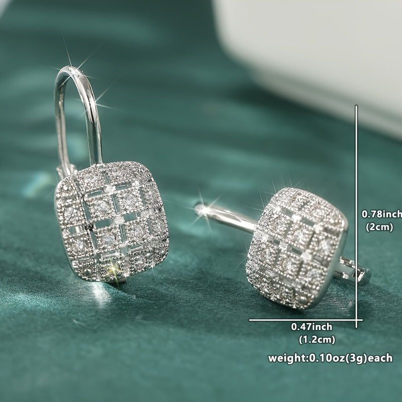 Zilveren vintage oorbellen met geometrisch open vlak en zirkonia