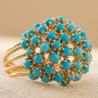 Gouden ring met turquoise bloemcluster