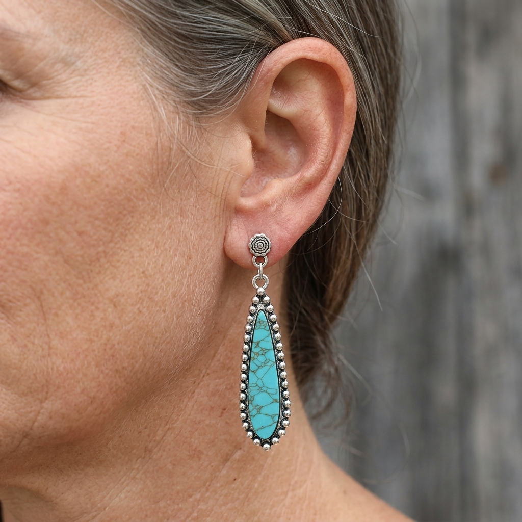 Zilveren western oorbellen met turquoise druppel