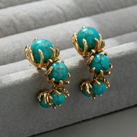 Gouden ring met ovale turquoise edelsteen