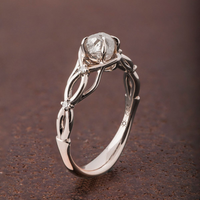 Zilveren gevlochten infinity-ring met heldere steen