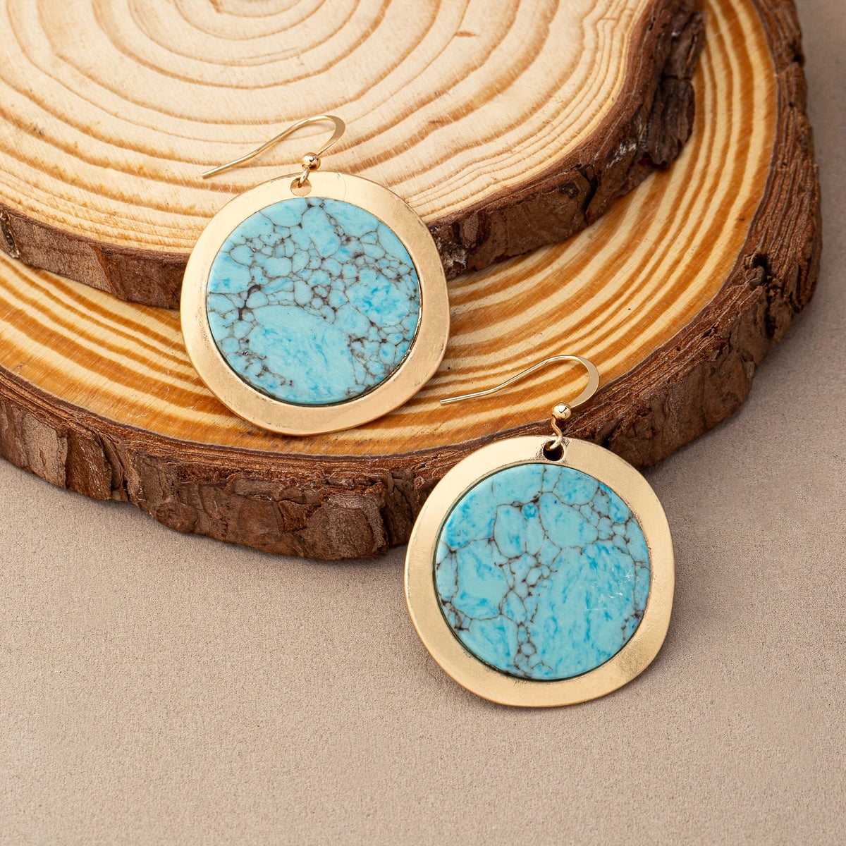 Zilveren oorbellen met ronde turquoise schijf