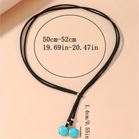 Bohemian lariat ketting van zwart koord met turkooizen kralen
