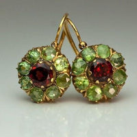 Gouden vintage bloemoorbellen met rode en groene kristallen