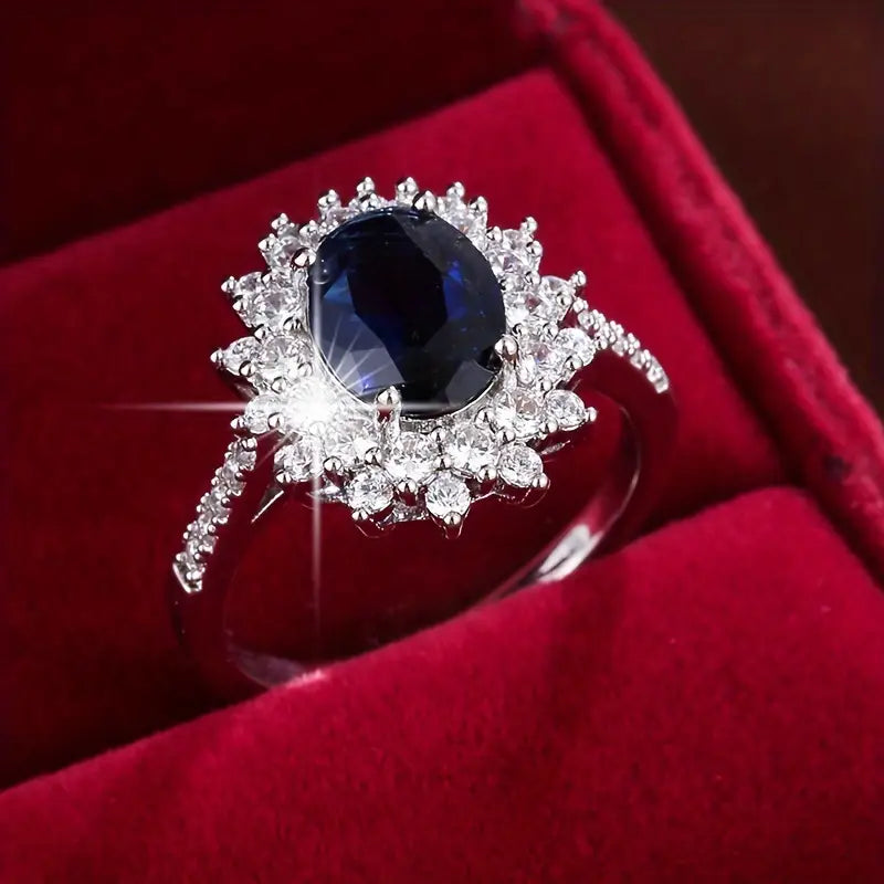 Gouden vintage ring met blauwe steen en zirkonia