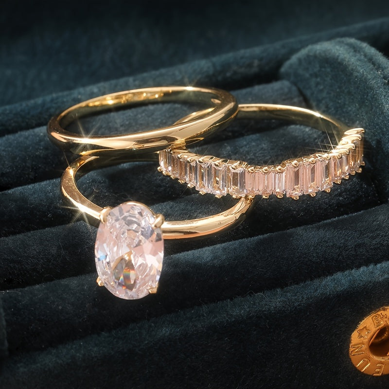 Gouden ring met ovale zirkonia en baguette band