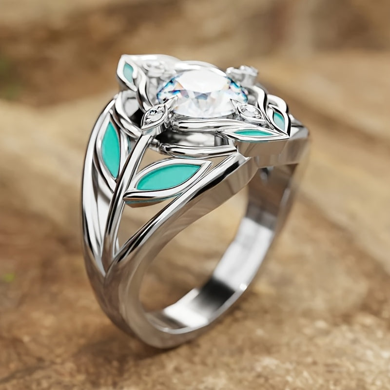 Zilveren ring met zirkonia en turquoise emaille blaadjes