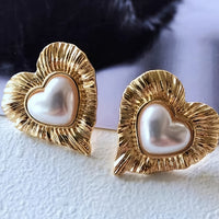 Gouden vintage hartoorbellen met parel