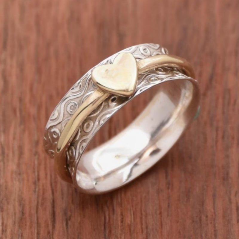 Zilveren gouden draairing met hart