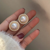 Gouden vintage oorbellen met parel en zirkonia