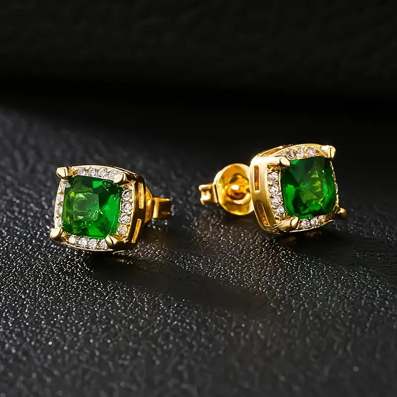 Gouden oorbellen met groene edelsteen en kristallen rand