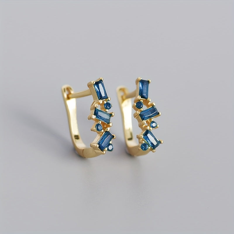 Gouden oorbellen met groene en blauwe stenen