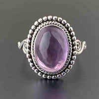 Zilveren vintage ring met ovale roze edelsteen