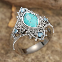 Zilveren vintage ring met marquise turkoois en blauwe steentjes