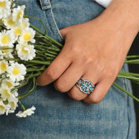 Zilveren ring met turquoise blaadjes en zirkonia