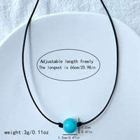 Bohemian lariat ketting van bruin koord met turkooizen kralen