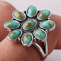 Zilveren ring met turquoise bloemcluster