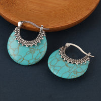 Zilveren bohemian oorbellen met turquoise schijf