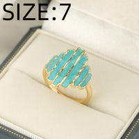 Gouden ring met turquoise geëmailleerde strepen